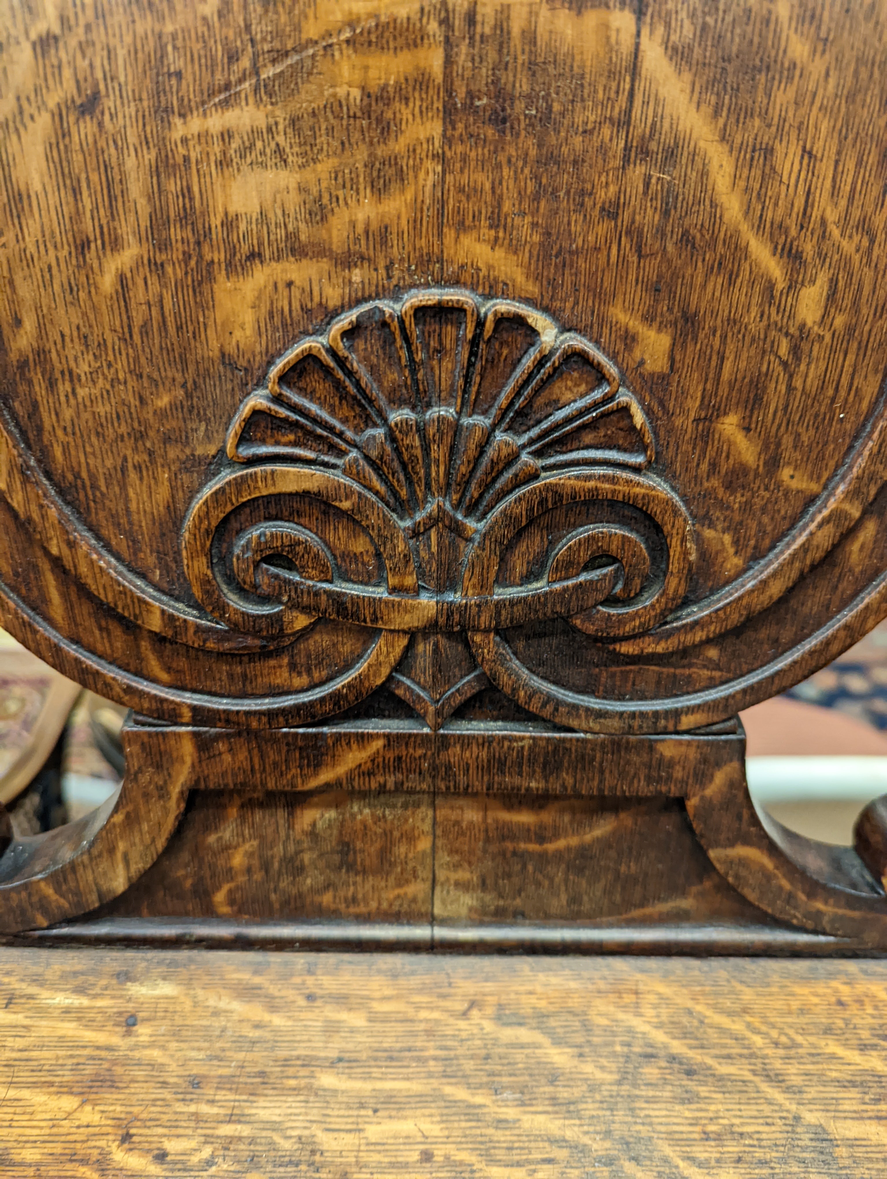 A pair of Victorian oak hall chairs with painted armorials, width 43cm, depth 39cm, height 94cm